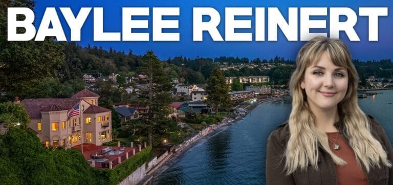 Luxurious waterfront home at twilight in the Pacific Northwest, featuring elegant architecture and a beautifully landscaped outdoor area with a view of the water.