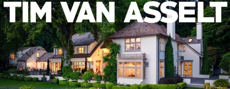 Elegant exterior view of a luxury home in the Pacific Northwest, featuring a beautifully landscaped yard, warm lighting, and a classic architectural design that blends seamlessly with the natural surroundings.